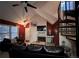 Cozy living room with a fireplace, spiral staircase, and vaulted ceilings for a comfortable atmosphere at 4933 S Carson St # 212, Aurora, CO 80015