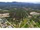 Showcases an overview of the community, highlighting its blend of wooded areas and scattered residences at 26499 West St, Conifer, CO 80433