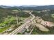 Aerial view of bustling mountain community, emphasizing its highway access and neighborhood layout at 26499 West St, Conifer, CO 80433
