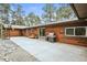 Back patio features a grill, bench and basketball hoop at 26499 West St, Conifer, CO 80433