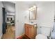 Bathroom with modern sink, mirror, and walk-in closet at 26499 West St, Conifer, CO 80433