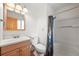 Bathroom with shower, bathtub, modern fixtures and sink at 26499 West St, Conifer, CO 80433