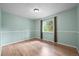 Bedroom features hardwood flooring and a large window with natural light at 26499 West St, Conifer, CO 80433
