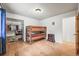 Bedroom features a wooden bunk bed, closet, and hardwood floors at 26499 West St, Conifer, CO 80433