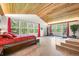 Bedroom with wood ceiling, large windows and a workout area filled with natural light and scenic views at 26499 West St, Conifer, CO 80433