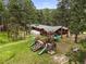 Backyard features a playground and plenty of space for activities at 26499 West St, Conifer, CO 80433