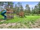 Backyard features a playground and plenty of space for activities at 26499 West St, Conifer, CO 80433