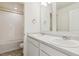 Well-lit bathroom featuring double sinks, a shower, and modern fixtures at 760 N Deer Park St, Watkins, CO 80137