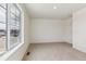 A bedroom featuring plush carpet, a bright window, and a closet at 760 N Deer Park St, Watkins, CO 80137