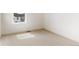 Bedroom featuring plush carpet and a window with neighborhood views at 760 N Deer Park St, Watkins, CO 80137