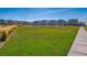 Beautiful homes line a lush, green lawn with walking path; perfect for enjoying the outdoors in this lovely community at 760 N Deer Park St, Watkins, CO 80137