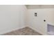 Interior view of a utilitarian laundry room with washer and dryer hookups at 760 N Deer Park St, Watkins, CO 80137