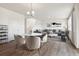 Open concept living area with dining space and modern decor, perfect for entertaining at 760 N Deer Park St, Watkins, CO 80137