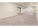 Large basement area with carpet and ample lighting ready to be used for additional living space at 8487 W 62Nd Pl, Arvada, CO 80004