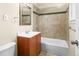 Clean bathroom with tiled shower-tub, modern vanity, and updated fixtures offering a refreshing space at 8487 W 62Nd Pl, Arvada, CO 80004