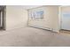 Inviting living room featuring neutral carpet and fresh paint, providing a versatile space at 8487 W 62Nd Pl, Arvada, CO 80004