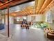 Unfinished basement features exposed ceiling, concrete floor, and natural light from the windows at 10565 Kicking Horse Dr, Littleton, CO 80125
