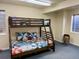 Bedroom features a bunk bed with a cozy stroller and natural light at 10565 Kicking Horse Dr, Littleton, CO 80125