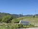Entrance to the Discovery Pavilion by Lockheed Martin, nestled among rolling hills and lush greenery at 10565 Kicking Horse Dr, Littleton, CO 80125