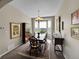 Elegant dining room with bay windows, a chandelier, and refined decor, creating a perfect setting for meals at 10565 Kicking Horse Dr, Littleton, CO 80125