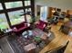 Open concept living area with large windows and a view to the kitchen and breakfast nook at 10565 Kicking Horse Dr, Littleton, CO 80125