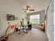 Comfortable office space featuring a ceiling fan and natural light from the window at 10565 Kicking Horse Dr, Littleton, CO 80125