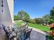 Stylish outdoor patio area with modern seating and lush landscaping, perfect for entertaining guests at 10565 Kicking Horse Dr, Littleton, CO 80125