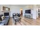 Inviting living room area with a cozy fireplace and modern decor at 7702 E 159Th Ave, Thornton, CO 80602