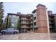 Apartment building showcasing multi-story design with balconies and ground-level parking at 765 Columbine St # C203, Breckenridge, CO 80424