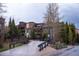 Powderhorn residence featuring brick accents, trees, and an inviting entrance at 765 Columbine St # C203, Breckenridge, CO 80424