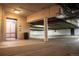 Brightly lit parking garage with concrete pillars, elevator access and visible safety markings at 765 Columbine St # C203, Breckenridge, CO 80424