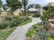 Beautiful garden path in a backyard, showcasing diverse plants and landscape design at 207 S Decatur St, Denver, CO 80219