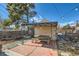 Backyard featuring a charming covered picnic area with table, benches, and concrete flooring at 207 S Decatur St, Denver, CO 80219