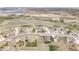 Desirable community featuring picturesque homes, lush greenery, and serene water views at 16300 Paris Way, Brighton, CO 80602