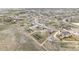 Aerial shot showcasing a quiet neighborhood with large lots, well-spaced homes, and green spaces at 16300 Paris Way, Brighton, CO 80602