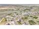 Drone shot highlighting a well-planned community with manicured lawns and serene streets at 16300 Paris Way, Brighton, CO 80602