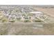 Spacious property showcasing a large lot, well-maintained landscaping, and neighborhood at 16300 Paris Way, Brighton, CO 80602