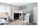 Playful bedroom with a loft bed, fun decor, and a cozy hammock for relaxation at 16300 Paris Way, Brighton, CO 80602