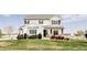 Charming two-story home features a manicured lawn and lovely landscaping at 16300 Paris Way, Brighton, CO 80602