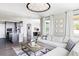 Spacious living room with an open layout and connection to the kitchen, perfect for modern living at 16300 Paris Way, Brighton, CO 80602