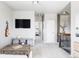 Open loft space with a TV, stylish furniture, and a view of the bedrooms for a versatile living area at 16300 Paris Way, Brighton, CO 80602