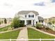 Spacious backyard with a well-maintained lawn, white fence, and a charming two-story home, ideal for outdoor living at 16300 Paris Way, Brighton, CO 80602