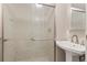 Bathroom with a modern shower with patterned glass enclosure and vanity at 2950 Hudson St, Denver, CO 80207