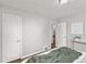 Well-lit bedroom with wood floors, closet, and views into the house at 2950 Hudson St, Denver, CO 80207