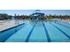 Sparkling community pool with blue tile and a waterslide offers a refreshing escape in a Gathering-friendly neighborhood at 2950 Hudson St, Denver, CO 80207