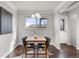 Inviting dining area with a modern light fixture and a window at 2950 Hudson St, Denver, CO 80207