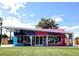 Colorful ice cream shop featuring a playful design, bright facade, and inviting storefront at 2950 Hudson St, Denver, CO 80207