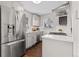Updated kitchen with stainless steel appliances, white subway tile backsplash and hardwood floors at 2950 Hudson St, Denver, CO 80207