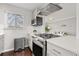 Bright updated kitchen featuring stainless steel appliances and white countertops at 2950 Hudson St, Denver, CO 80207