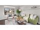 Cozy living room with lots of natural light, an area rug, and stylish furnishings at 2950 Hudson St, Denver, CO 80207